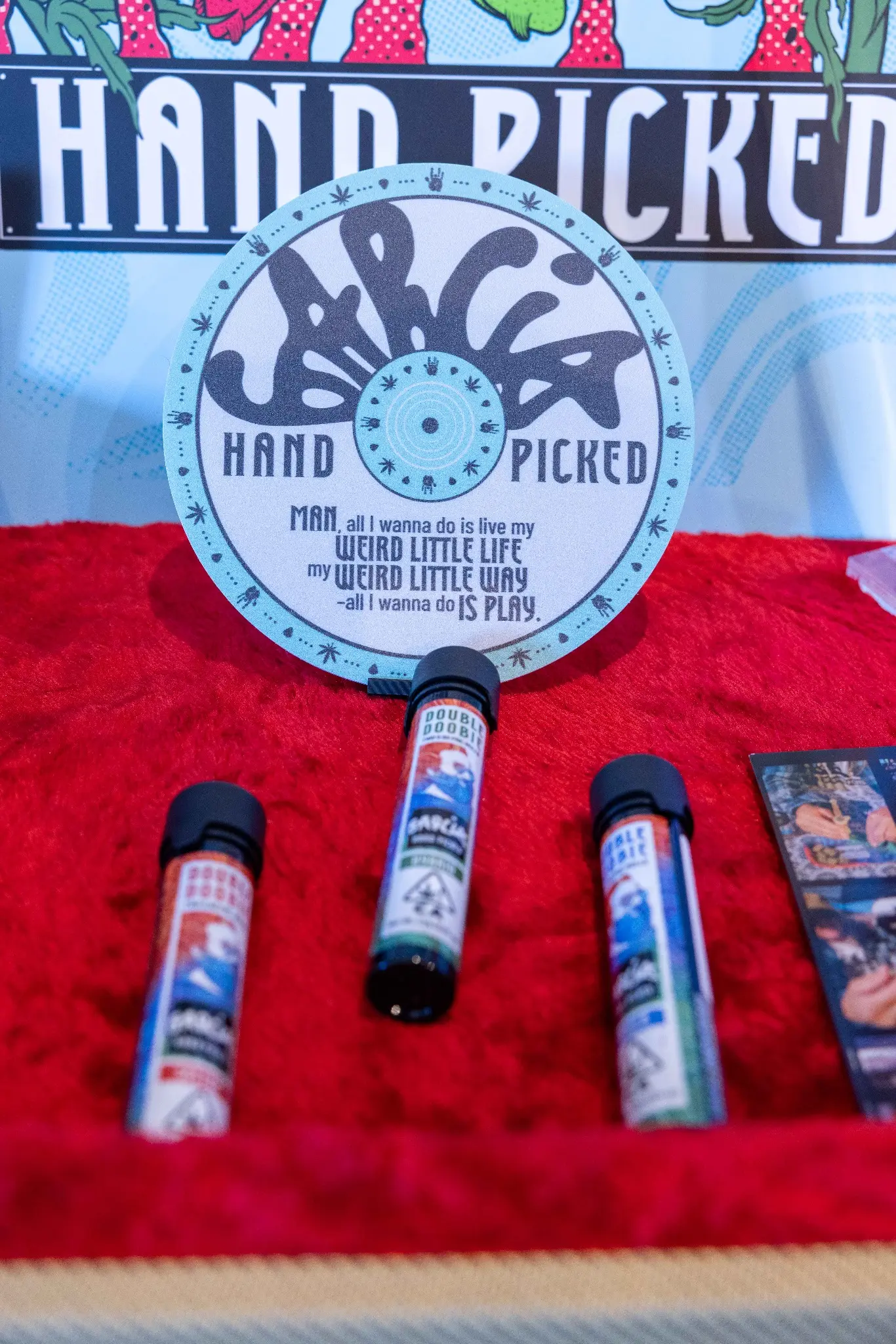 Garcia Hand Picked pre-roll tubes and record-inspired sign
