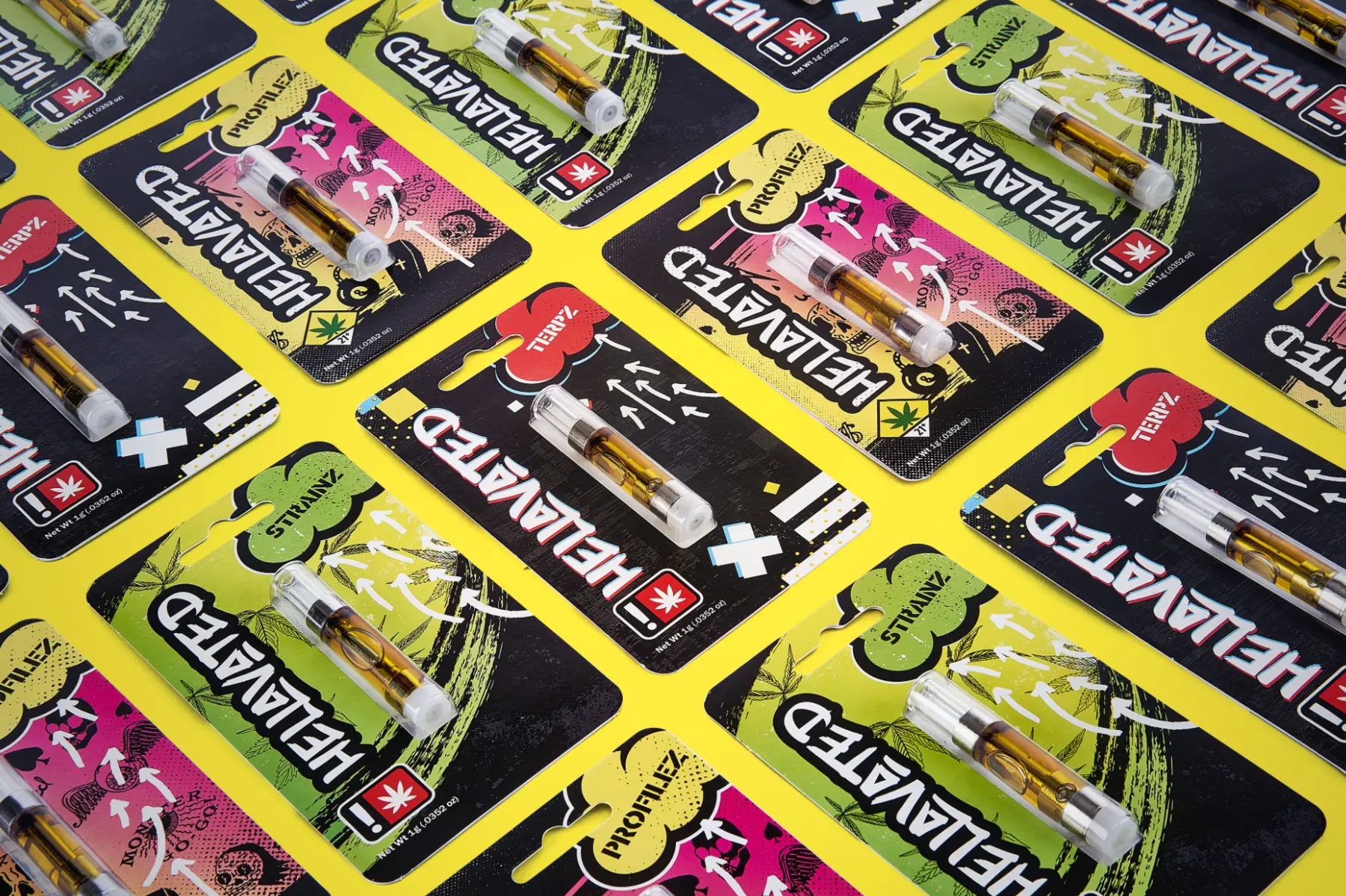 Earlier Hellavated vape packaging in a yellow flat lay
